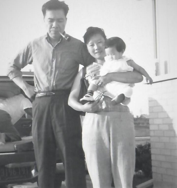 The author at 16 months old with her parents, one month after she arrived in the U.S. The photo was taken in Park Forest, Illinois, in July 1960.
