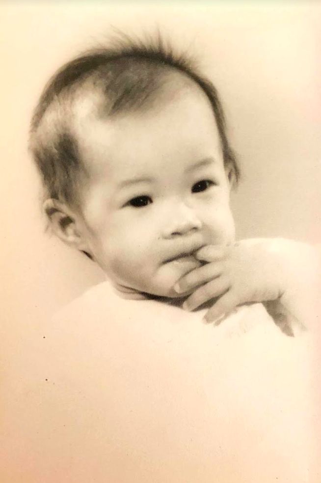 The author’s parents chose to adopt her based on this photo and two others they received from an adoption agency. The author is of an unknown age in this photo taken in Hong Kong (circa 1959 to 1960).