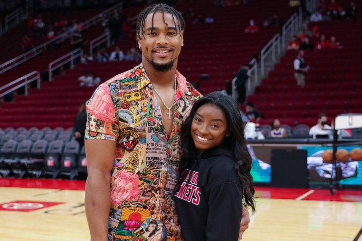 Simone Biles and Jonathan Owens attend a game between the Houston Rockets and the Los Angeles Lakers at Toyota Center in December 2021.