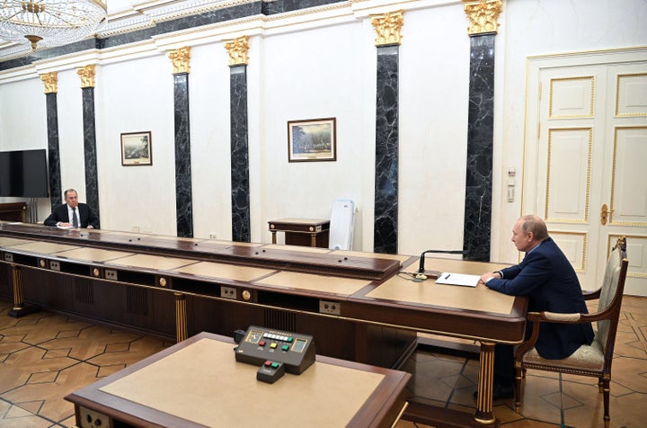 Russian President Vladimir Putin (R) and Foreign Minister Sergei Lavrov hold a meeting at the Kremlin, in Moscow on Monday.