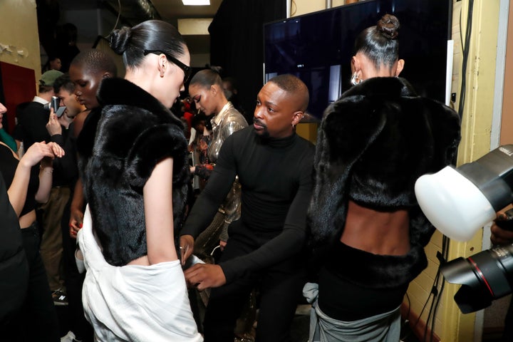 Julia Fox, Post Kanye West Breakup, Opens NYFW Show 2 Designer LaQuan Smith prepares a model backstage for his show.