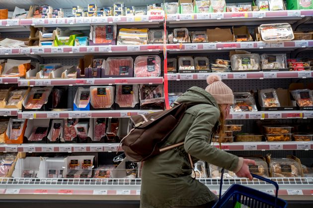 A customer shops for meat at a Sainsbury's supermarket in Walthamstow, east London on February 13, 2022. 