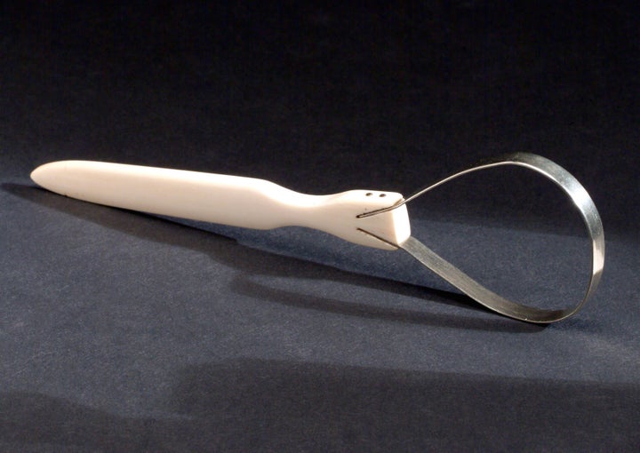 Silver and ivory tongue scraper, circa 1800.