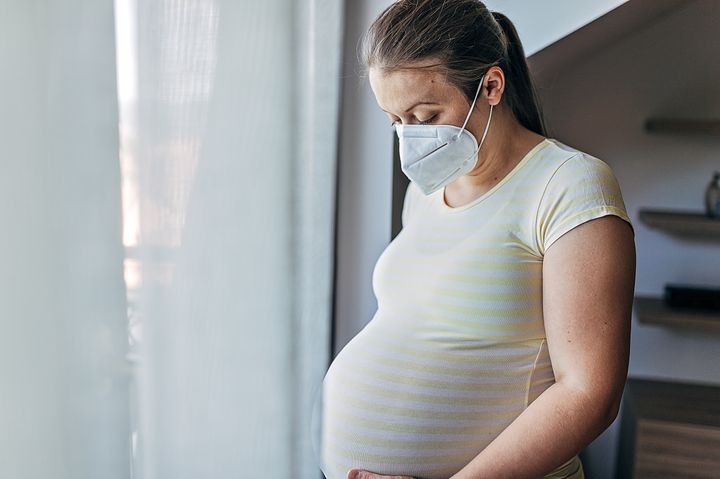 Doctors share the best advice for monitoring COVID symptoms if you're infected while pregnant.