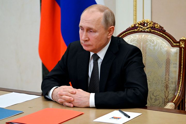 Russian President Vladimir Putin chairs a Security Council meeting via video conference at the Novo-Ogaryovo residence outside Moscow, Russia, on Feb. 18, 2022. 
