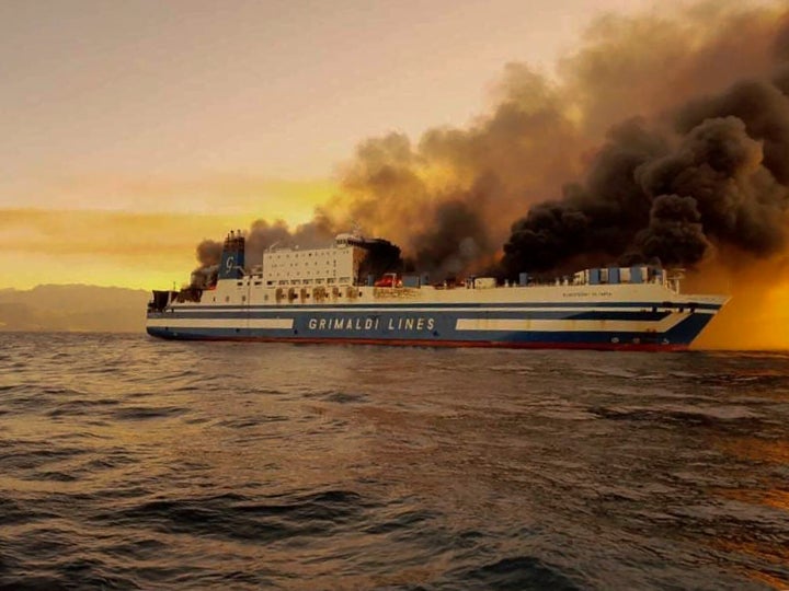 A ferry is on fire at the Ionian Sea near the island of Corfu, Greece, on Friday, Feb. 18, 2022. More than 280 people have been evacuated from the ferry in northwestern Greece that caught fire overnight, while heading to southern Italy, authorities said. (Lazos Mantikos/debater.gr. via AP)