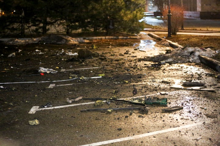 Debris from a blown up car, in Donetsk, the territory controlled by pro-Russian militants, eastern Ukraine, Friday, Feb. 18, 2022.