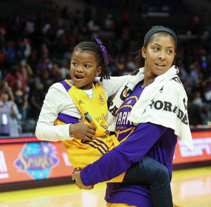 Candace Parker holds her daughter, Lailaa Nicole Williams, after an WBNA basketball game in Los Angeles on Sept. 30, 2016.