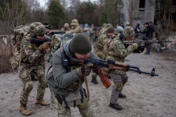 Reservists take part in a tactical training and individual combat skills conducted by the Territorial Defense of the Capital in Kyiv, Ukraine, on Saturday.
