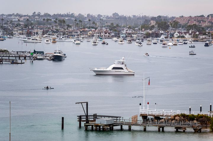 Boats are moored near the entrance of Newport Harbor in Newport Beach, California. A police helicopter crashed in the water near the harbor on Saturday evening, killing one officer and injuring a second, authorities said.