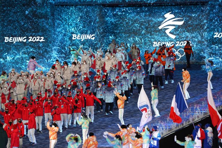 Athletes make their way into the stadium for the closing ceremony.