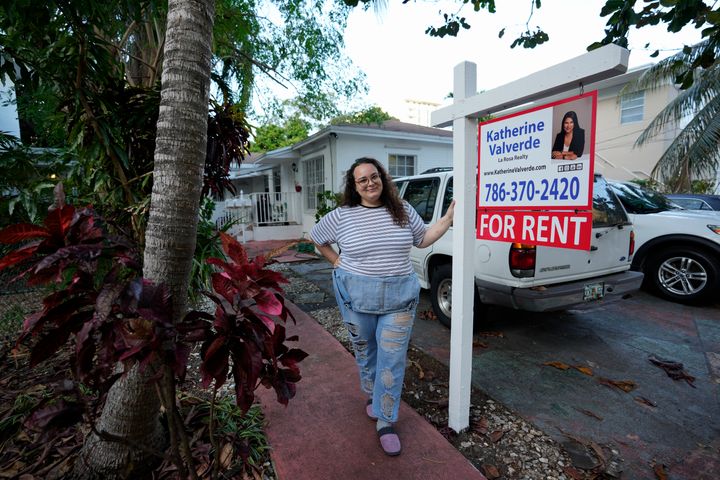 Krystal Guerra, 32, poses for a picture outside her apartment, which she has to leave after her new landlord gave her less than a month's notice that her rent would go up by 26%.