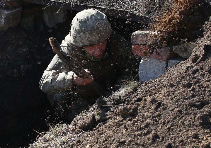 A Ukrainian soldier is on the front line with Russia-backed separatists not far from Novohnativka, Donetsk region, on Feb. 20, 2022.