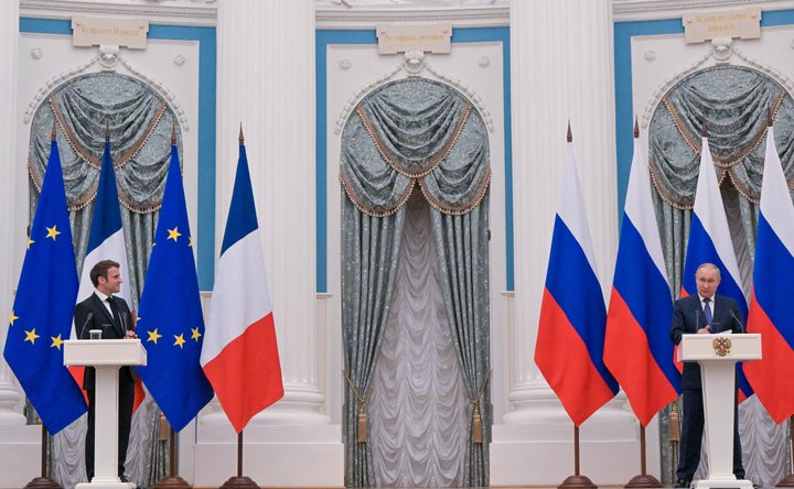 France's President Emmanuel Macron (L) and Russia's President Vladimir Putin give a joint press conference after a meeting at the Moscow Kremlin. (Photo by Sergei Guneyev\TASS via Getty Images)