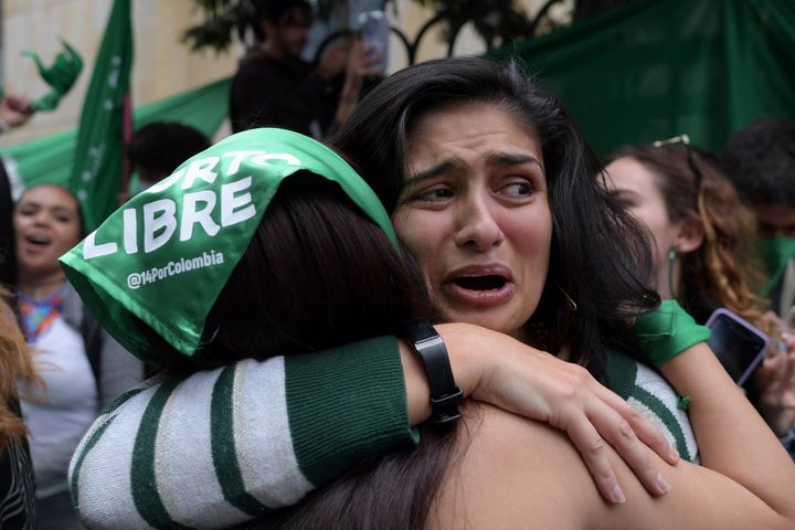 Abortion rights activists celebrate the decision of Colombia's high court to decriminalise abortion up to 24 weeks of pregnancy.