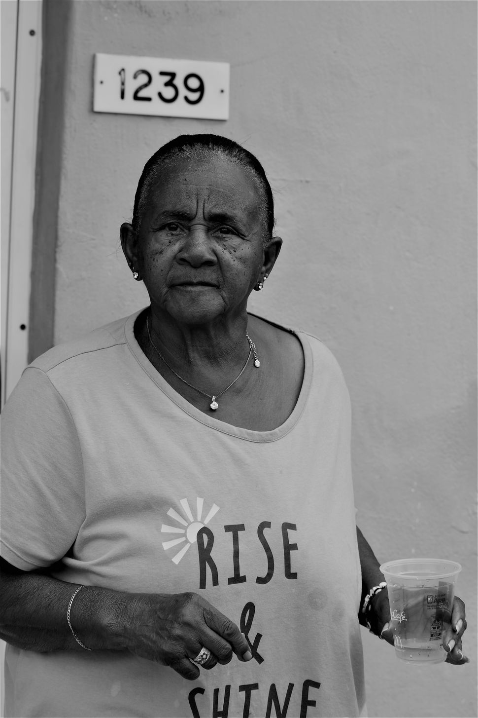 Food: A grandmother and matriarch photographed in front of her home in the Pork 'n Beans housing projects in Miami's quickly gentrifying Liberty City area in 2018.