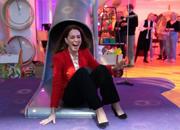 The Duchess of Cambridge goes down a slide during a visit to the Lego Foundation PlayLab on Feb. 22 in Copenhagen, Denmark.