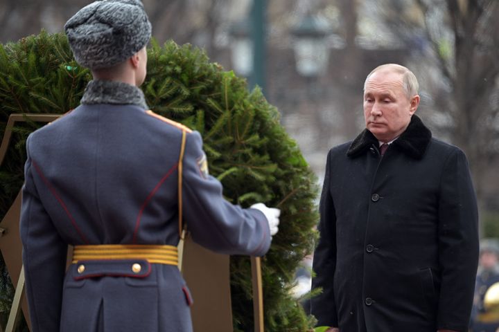Vladimir Putin takes part in a wreath laying ceremony at the Tomb of the Unknown Soldier in Moscow's Alexander Garden 
