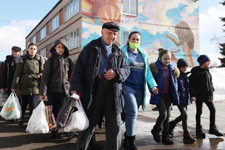 People evacuated from Donbass are seen at a temporary accommodation center at the Mechta children's health resort.