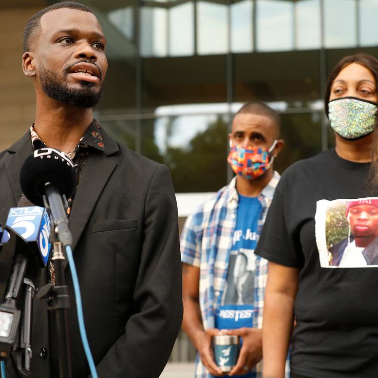Activist Jerome Kitchen, left, a close friend of Gemmel Moore, who died in 2017 in the West Hollywood apartment of Ed Buck, addresses a July 2021 press conference with LaTisha Nixon, the mother of Gemmel Moore. Buck was convicted a few days later in the overdose deaths of Moore and Timothy Dean.