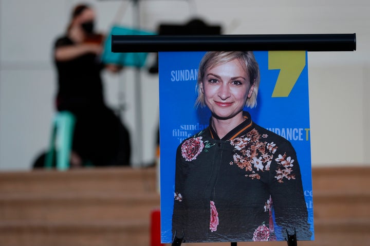 A violinist performs behind a photograph of cinematographer Halyna Hutchins during an Oct. 23, 2021, vigil in her honor in Albuquerque, New Mexico.