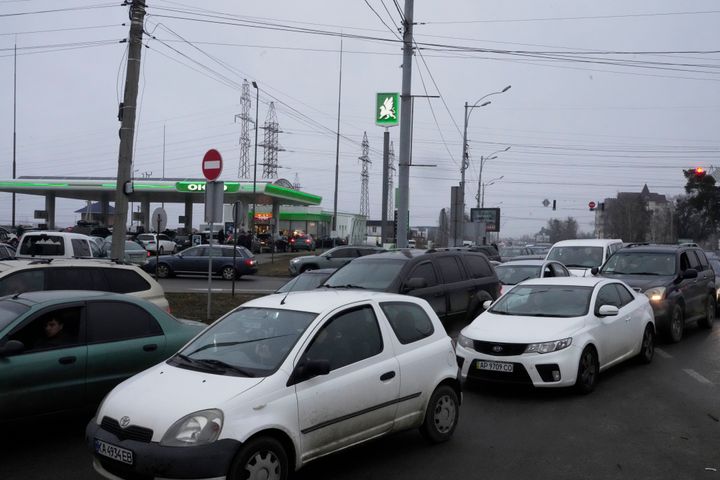 Vehicle line up at a gasoline station in Kyiv, Ukraine on Thursday, after Russian troops launched their anticipated attack.
