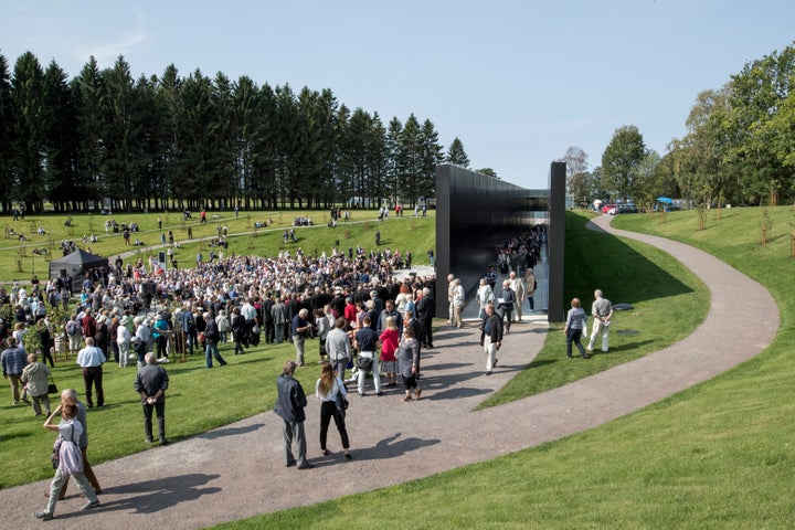 People gather at The Memorial of Victims of Communism to mark the European Day of Remembrance for Victims of Stalinism and Nazism, also known as Black Ribbon Day, in Tallinn, Estonia, on Aug. 23, 2018. 