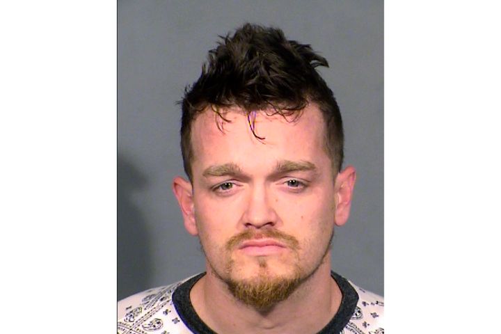 Brandon Lee Toseland, 35, of Las Vegas, is seen following his arrest Tuesday on murder and kidnapping charges. Authorities say a schoolgirl gave a note to her teacher saying her mother was being held captive and that her younger brother was missing, leading to the discovery of the boy's body in a garage freezer and Toseland's arrest.