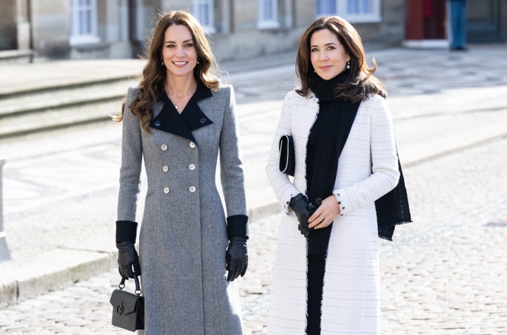 The Duchess of Cambridge and Crown Princess Mary of Denmark walk across the Amalienborg courtyard on Feb. 23 in Copenhagen, Denmark.