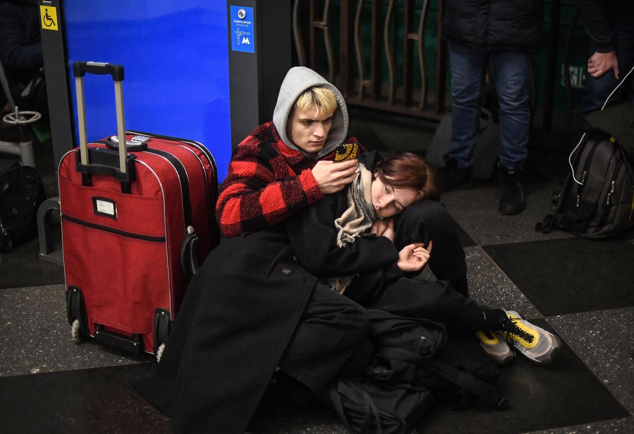 People taking shelter in a metro station in Kyiv. Air raid sirens rang out in downtown Kyiv as it faced what Ukrainian officials said were Russian missile strikes and artillery.