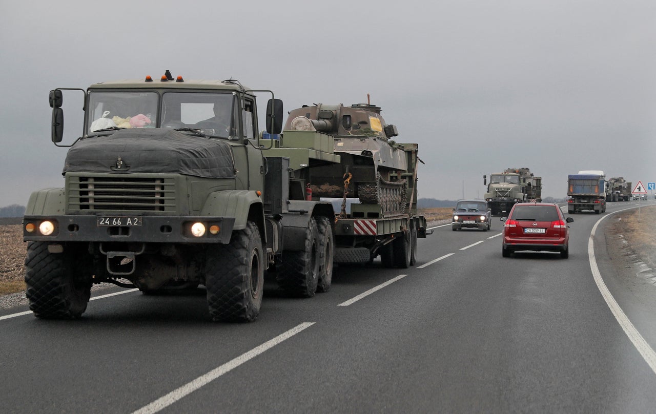 Ukrainian Armed Forces trucks transport armored vehicles in the Kyiv region.