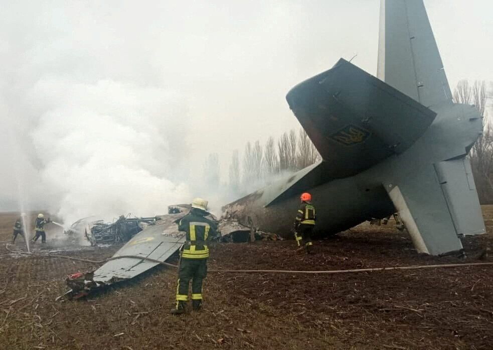 Rescuers work at the crash site of a Ukrainian Armed Forces' Antonov aircraft, which, according to the State Emergency Service, was shot down in the Kyiv region on Thursday.