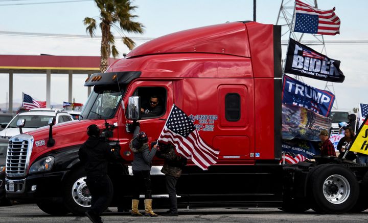 Truckers and their supporters form a convoy in Adelanto, California, bound for the nation's capital to protest COVID-19 vaccine mandates on Feb. 23, 2022.