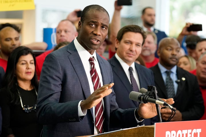 Florida Surgeon General Dr. Joseph Ladapo is seen with Gov. Ron DeSantis in Brandon, Fla., last November.