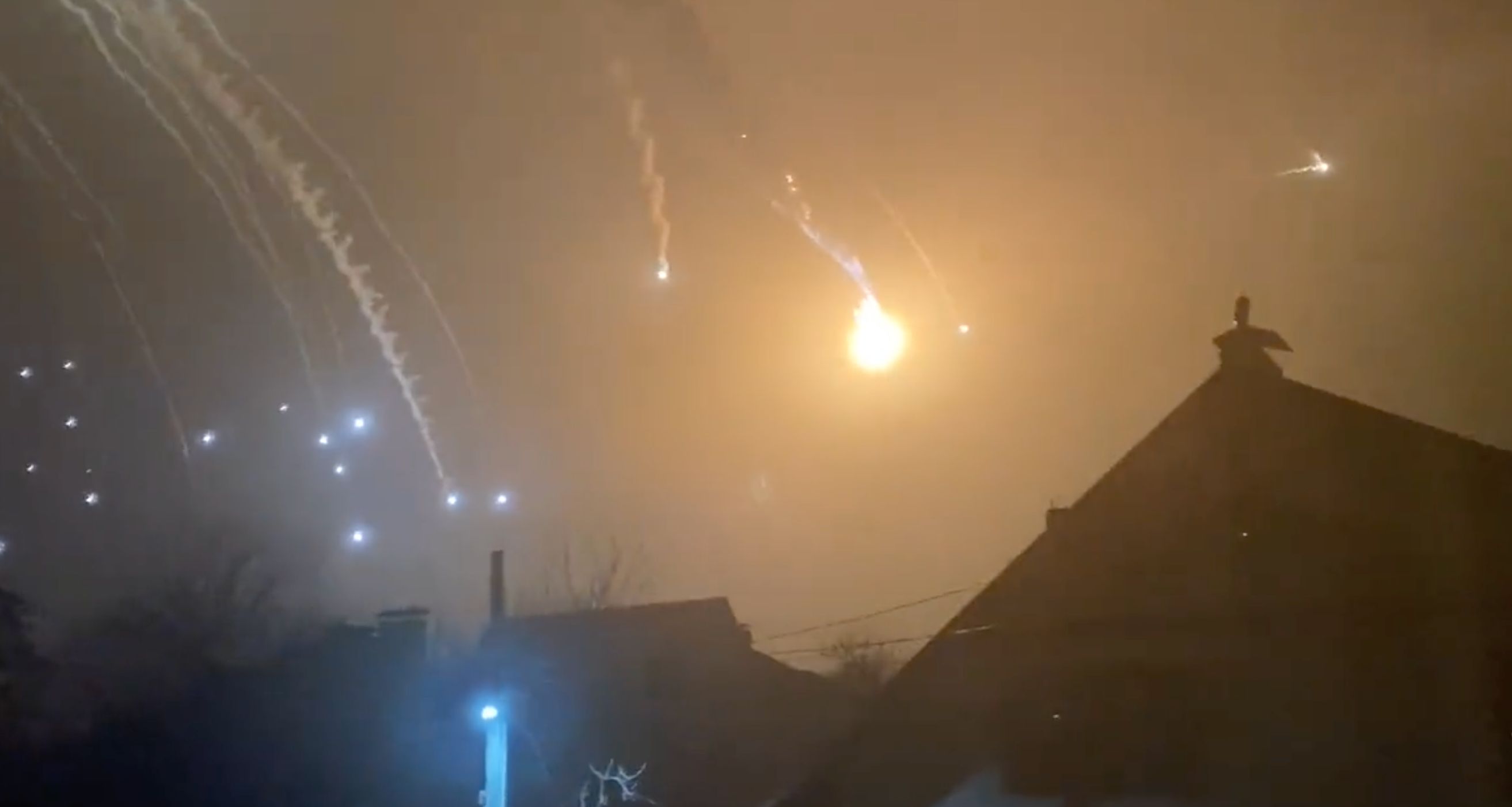 Falling missiles light up night sky in Ukraine.