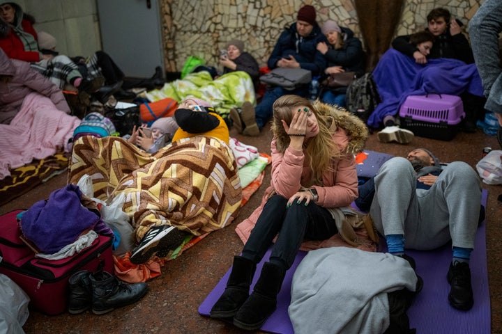 People rest in the Kyiv subway, using it as a bomb shelter in Kyiv, Ukraine, on Feb. 24, 2022.