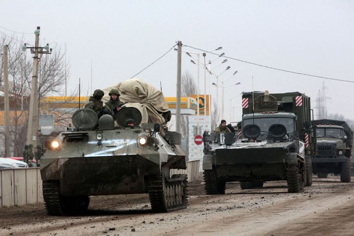 Russian army military vehicles are seen in Armyansk, Crimea, on February 25, 2022. - Ukrainian forces fought off Russian invaders in the streets of the capital Kyiv on February 25, 2022, a