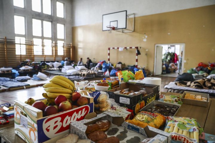 Beds and supplies fill a school gym repurposed as a shelter for Ukrainian refugees arriving in Przemysl, Poland.