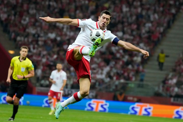 Poland's Robert Lewandowski controls the ball during the World Cup 2022 group I qualifying soccer match between Poland and England in 2021.