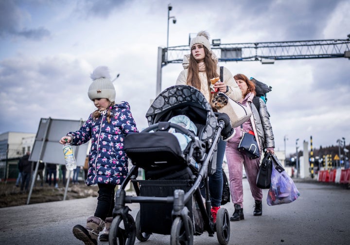 Refugees from Ukraine crossing the border in Poland. 