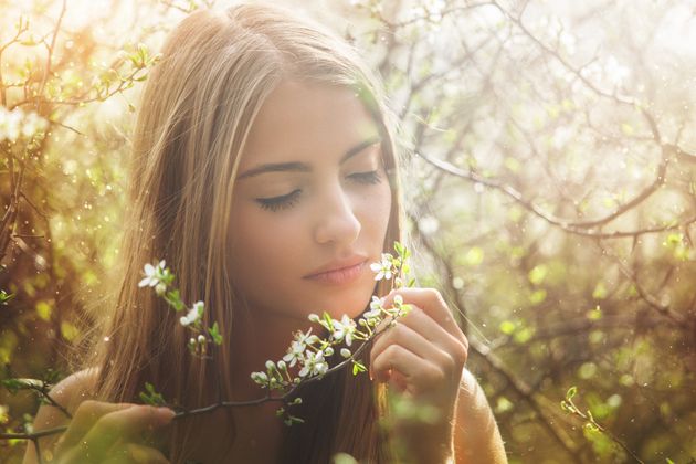 Beauty with a flower in the spring