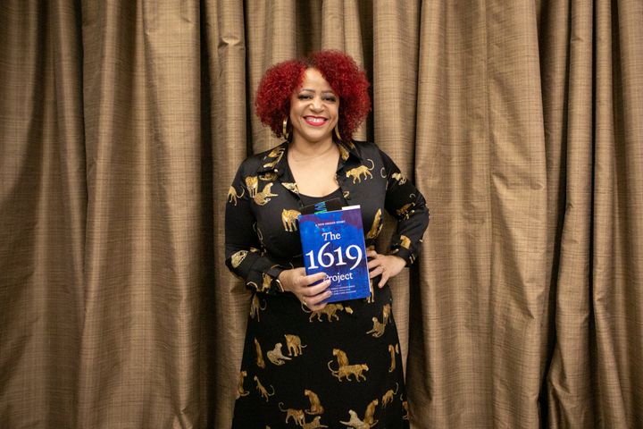 Nikole Hannah-Jones poses with her book, "The 1619 Project: A New Origin Story," at a Los Angeles Times book club event in November. 