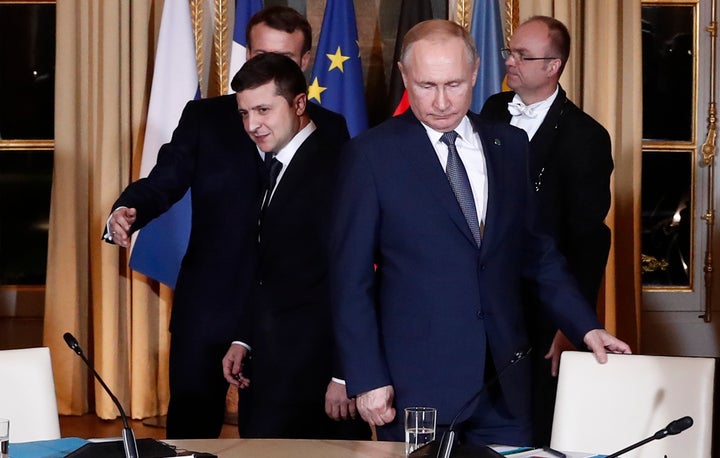 FILE - Russian President Vladimir Putin, right, and Ukrainian President Volodymyr Zelenskyy arrive for a working session at the Elysee Palace, Dec. 9, 2019, in Paris. (Ian Langsdon/Pool via AP, File)