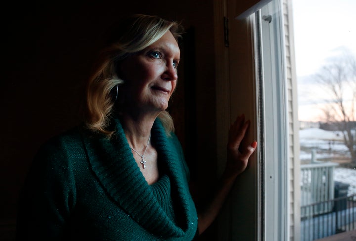 Christine Zuba poses for a portrait at her home in Blackwood, New Jersey, on Monday, Feb. 14, 2022. After coming out as a transgender woman at age 58, Zuba, a lifelong Catholic, was welcomed into Saints Peter and Paul Catholic Church, where she currently serves as a eucharistic minister. (AP Photo/Jessie Wardarski)