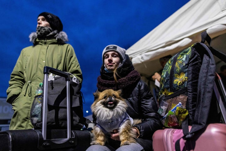 Ukrainian refugees arrive from the Medyka pedestrian border crossing, in Przemsyl, eastern Poland.