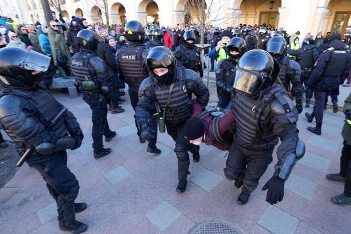 Police detain a demonstrator protesting Russia's attack on Ukraine in St. Petersburg, Russia, on Sunday.