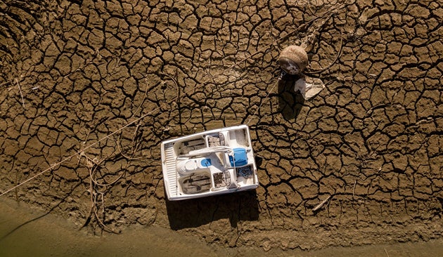 A marooned boat sits along a dry portion of the Lake Oroville lakebed in Oroville, California, on Sept. 5, 2021.