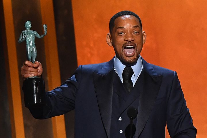 Will Smith accepts the award for Outstanding Performance by a Male Actor in a Leading Role for King Richard during the 28th annual Screen Actors Guild Awards at the Barker Hangar in Santa Monica, California, on Sunday.