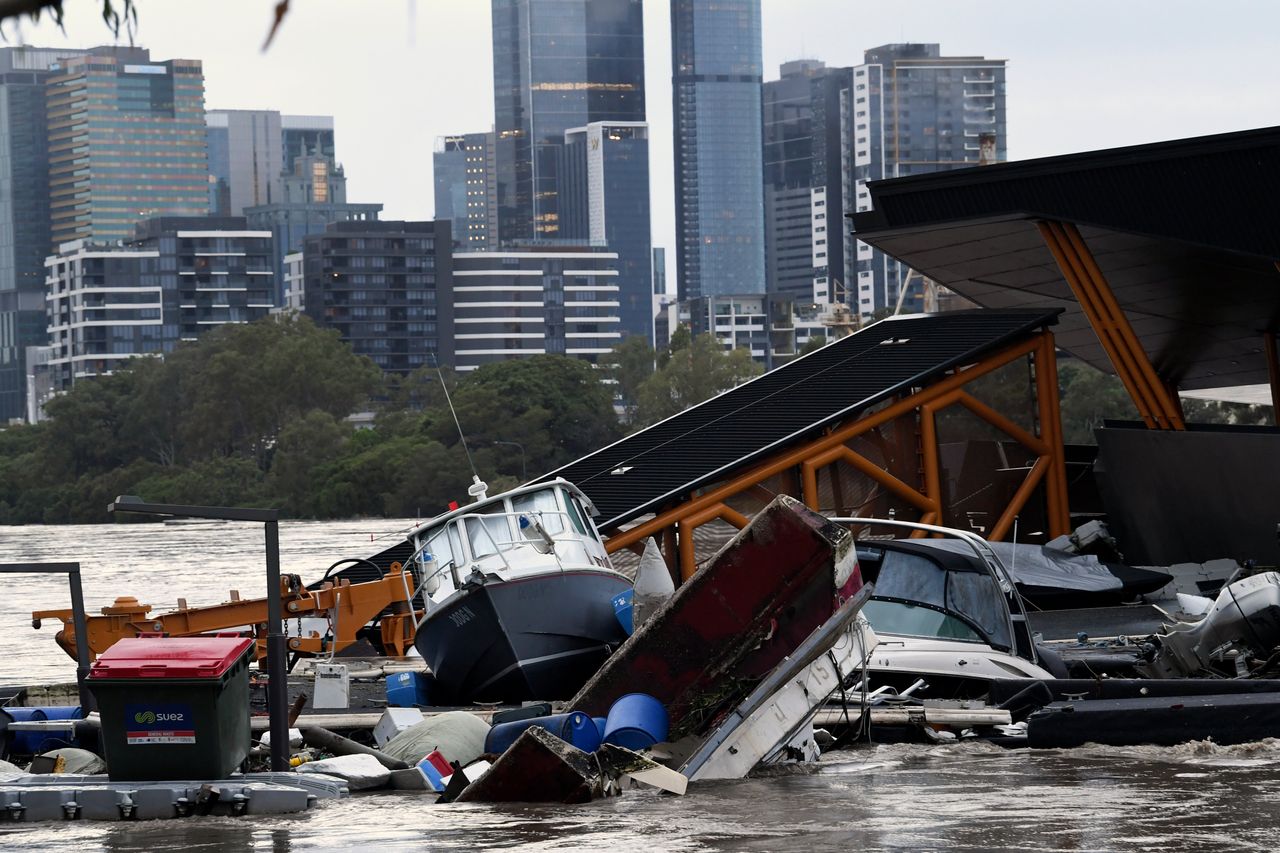 Boats and other debris were washed into the Milton ferry terminal on the Brisbane River in Brisbane, Australia on Monday.