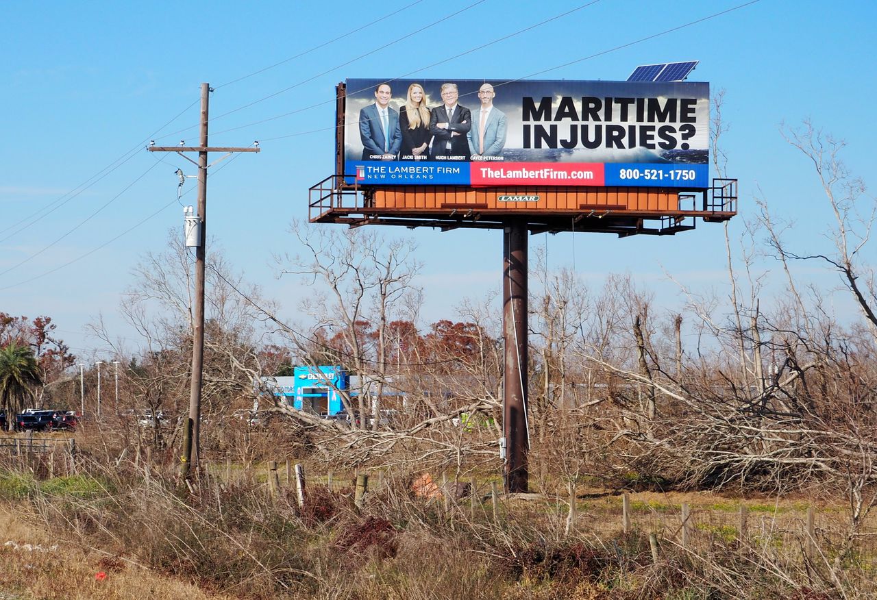 Billboards for maritime injury lawyers line the roads of Lafourche Parish, Louisiana.